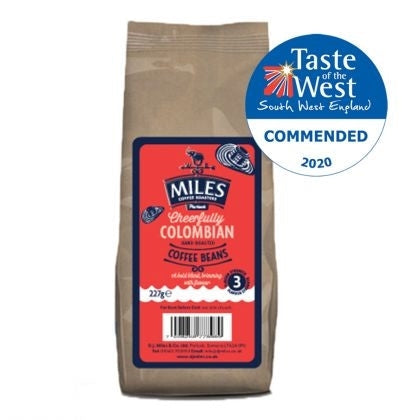 A bag of Miles Colombian coffee beans with a Taste of the West commendation badge.