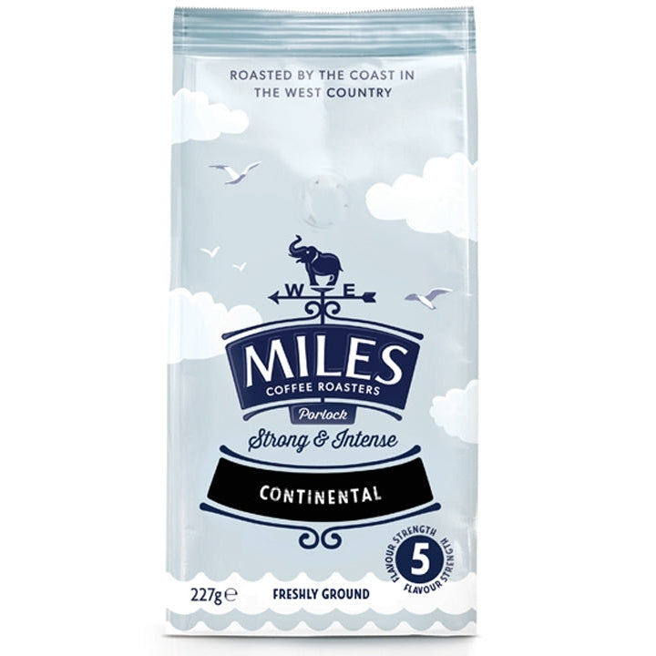 A package of Miles Continental ground coffee, with an illustration of a sheep and birds against a cloudy sky background.
