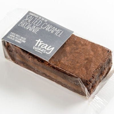 Packaged brownie with salted caramel label, wrapped in plastic, with a white background.