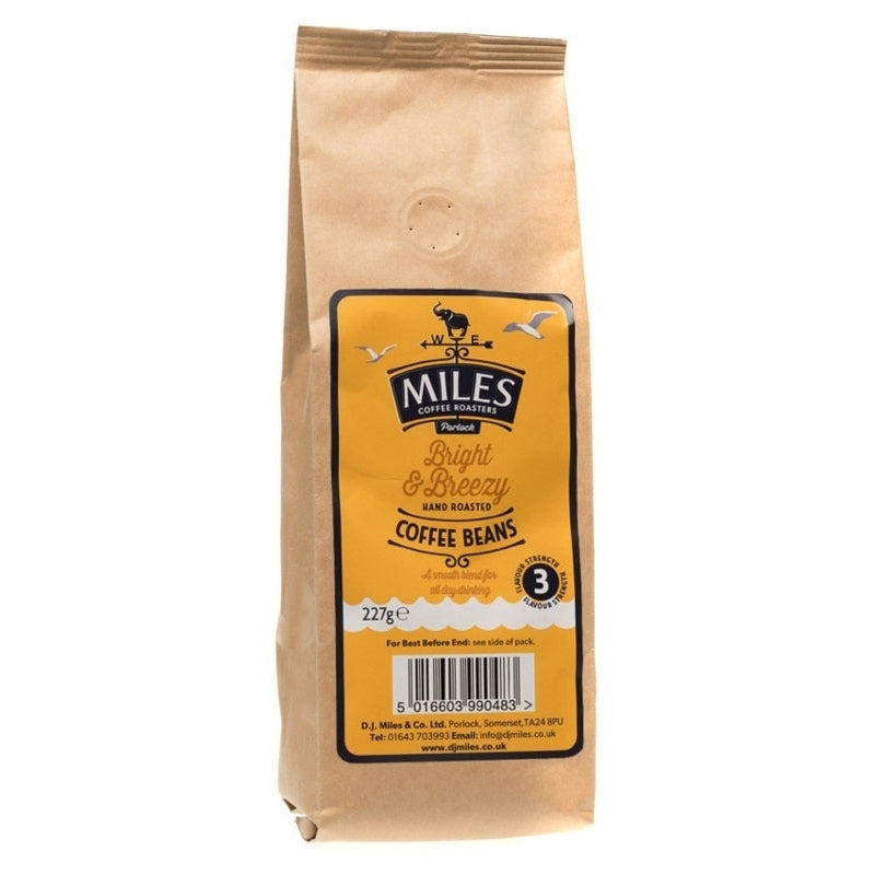 A pack of Miles Bright and Breeze coffee beans in a yellow package with a barcode and the weight 227g displayed.