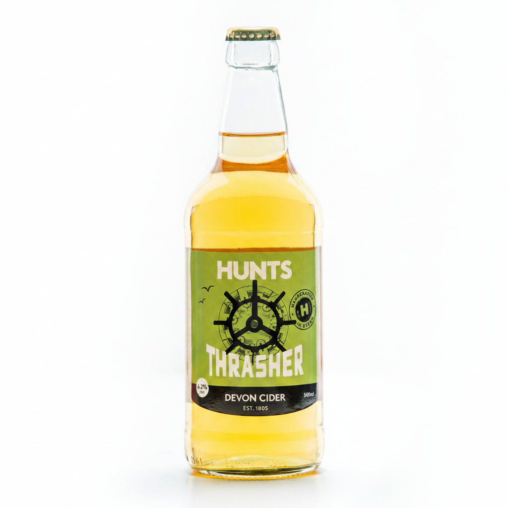 A bottle of Hunts Thrasher Devon Cider with a yellow label and green branding.