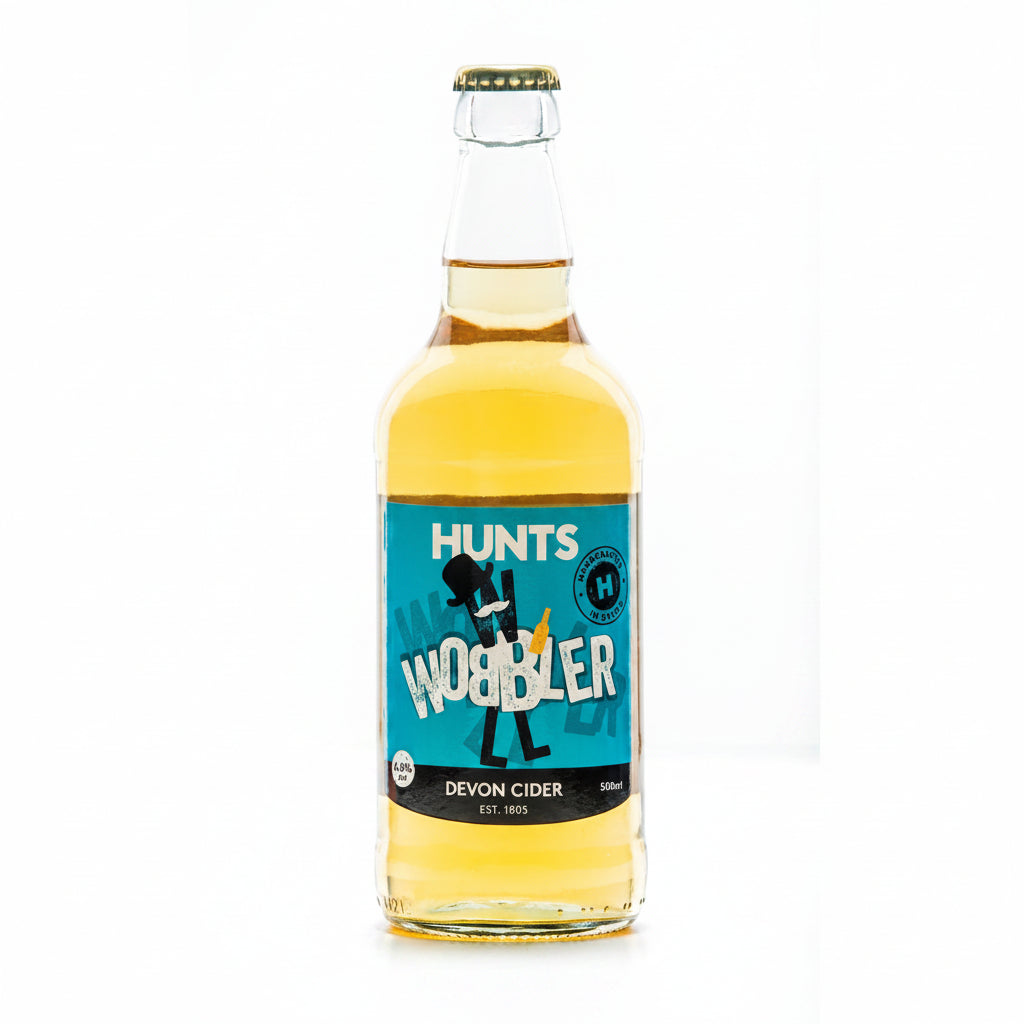 A bottle of Hunts Cider Wobble with a label that has the brand name and 'WOBBLER' text, indicating it's a Devon Cider product.