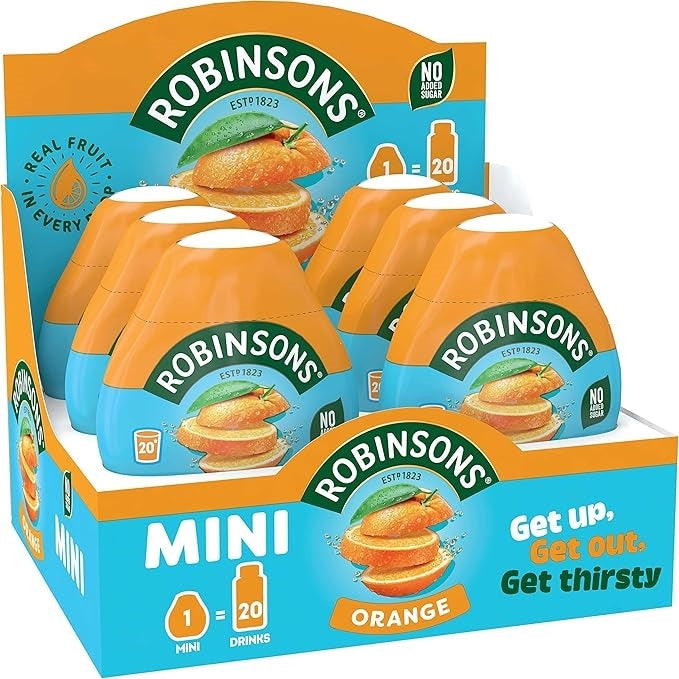 A Robinsons Mini Orange drink mix display box containing multiple individual bottles, with orange and blue packaging and Robinsons branding.