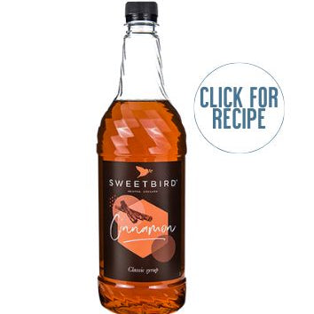 A bottle of SWEETBIRD cinnamon syrup with a label that includes the brand name and the words 'click for recipe'. The background is white and clean.