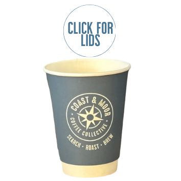 A stack of disposable coffee cups with a 'Coast and Moor' branding label on the front.