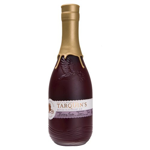 A bottle of TARQUIN'S BLACKBERRY GIN with a clear label showing the brand and the blackberry theme.