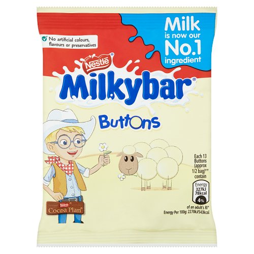 Packaging of Nestle Milkybar Buttons, featuring a cartoon of a boy with glasses holding a flower, with the Milkybar logo and a background image of sheep. The pack indicates 'Artificial colours or flavours' and 'No artificial flavours'.