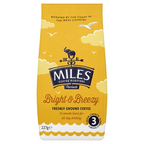 A package of Miles Bright and Breezy ground coffee, featuring an illustration of a horse and birds on a yellow background, with the weight of 227g highlighted.