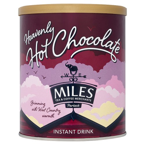 A tub of Miles Heavenly Hot Chocolate with a purple and pink color scheme and a graphic of a hot air balloon.