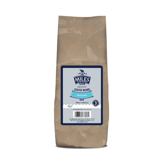 A bag of Miles brand coffee beans, 1kg, with a label indicating 'Coffee Beans' and 'Ethically Sourced'. The bag is brown with a blue and white label.