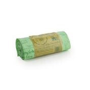 A rolled up green compostable sack with a visible label.