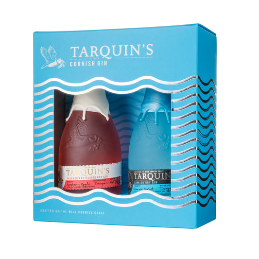 A packaged gift set of TARQUIN'S Cornish Gin, containing two bottles of gin with distinct red and blue labels, presented in a blue box with wave patterns.