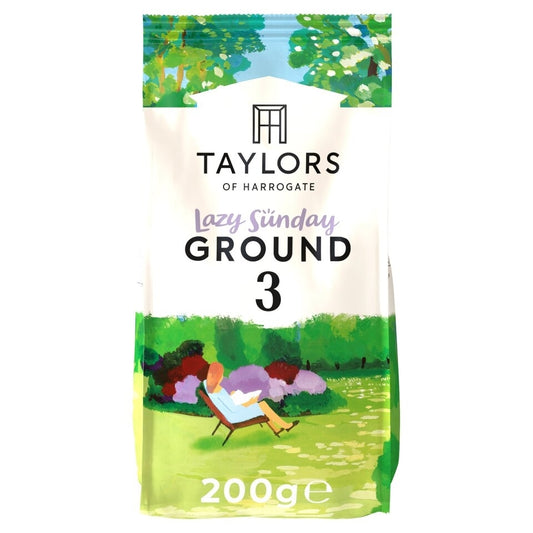 Packaging of Taylors Lazy Sunday Ground Coffee, showing a 200g bag with a printed illustration of a person relaxing in a garden.