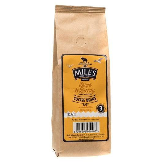 A pack of Miles Bright and Breeze coffee beans in a yellow package with a barcode and the weight 227g displayed.