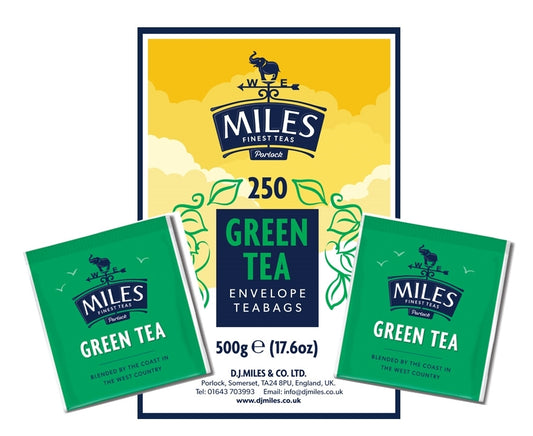 Packaging for Miles Green Tea Enveloped Teabags, showing a yellow and green box with teabags visible and product details.