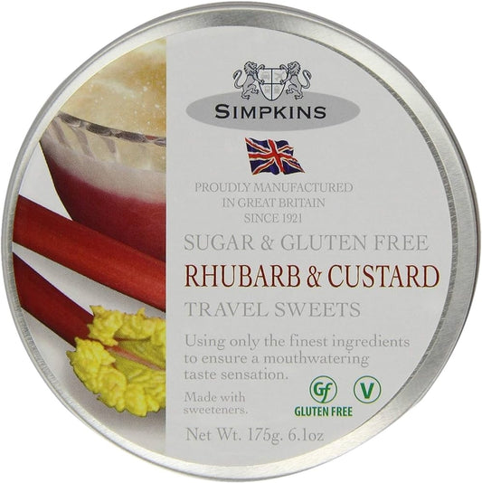 A tin of Simpkins Rhubarb & Custard Travel Sweets with a clear window showing the red rhubarb and custard sweets inside. The label indicates that the product is sugar and gluten free, and that it is vegan friendly.