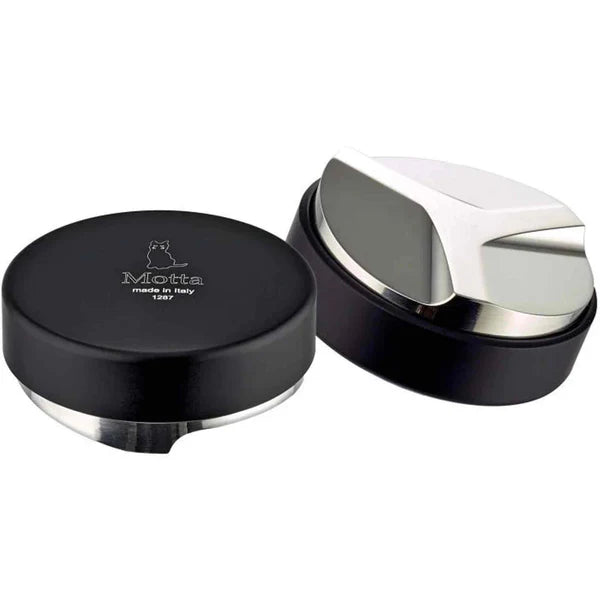 A Motta coffee levelling tool, consisting of a black base with a silver-colored tamper.