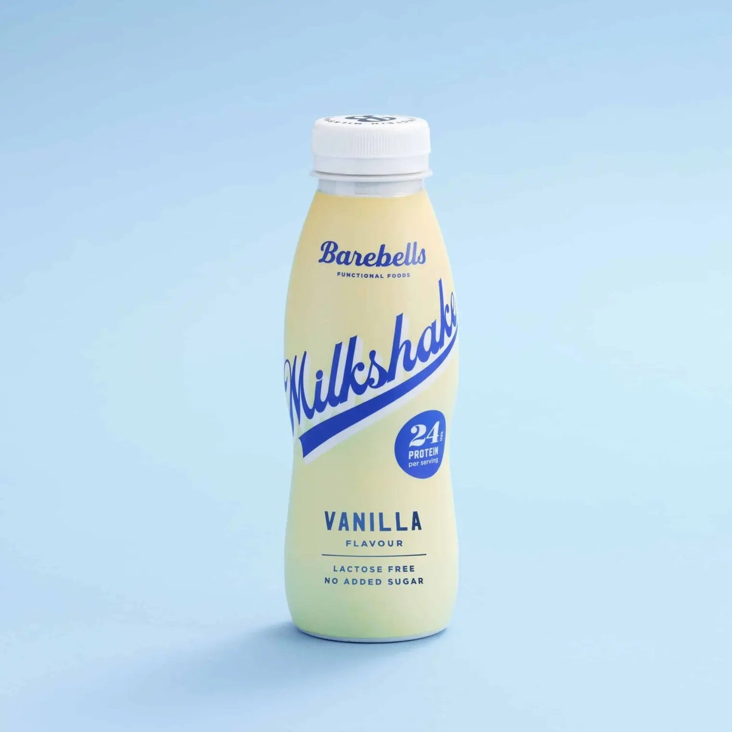 A bottle of Barebells Vanilla Milkshake protein drink on a light blue gradient background. The bottle is pale yellow with blue and white branding.