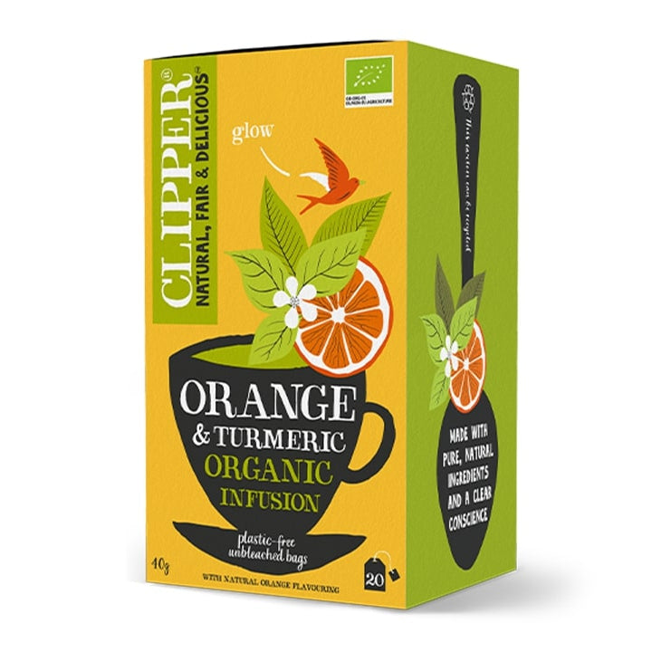 A box of CLIPPER Orange & Turmeric Organic Tea with 20 tea bags. The packaging is predominantly yellow and green, with an image of an orange slice and the tea bag visible through the box window.
