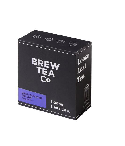A black box of BREW TEA LOOSE DECAFTEA with text indicating it is decaffeinated and has a woody & earthy flavor.