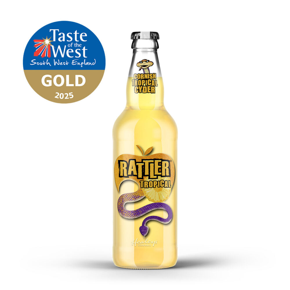 A bottle of Rattler Tropical cider with a gold and purple label, shown on a white background with a Taste of the West South West England Gold 2025 award badge in the top left corner.