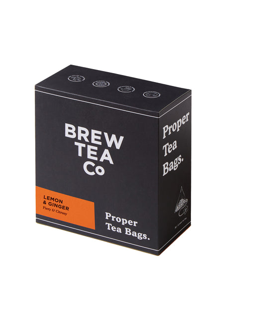 A box of BREW TEA TAGGED TEABAGS Lemon and Ginger with 100 tea bags, predominantly black and orange packaging.