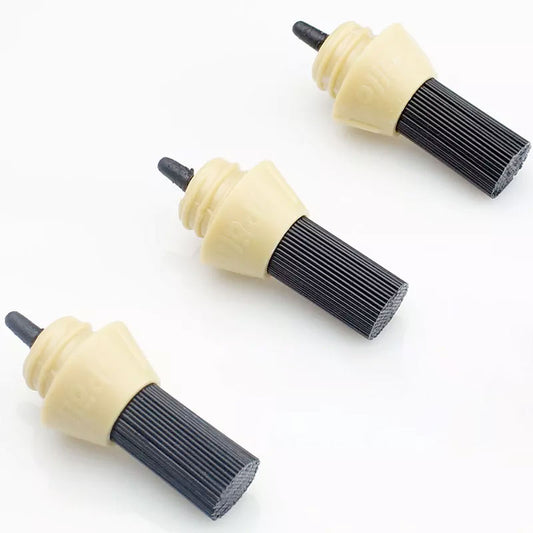 Three replacement heads for a coffee machine brush, with beige handles and black bristles.