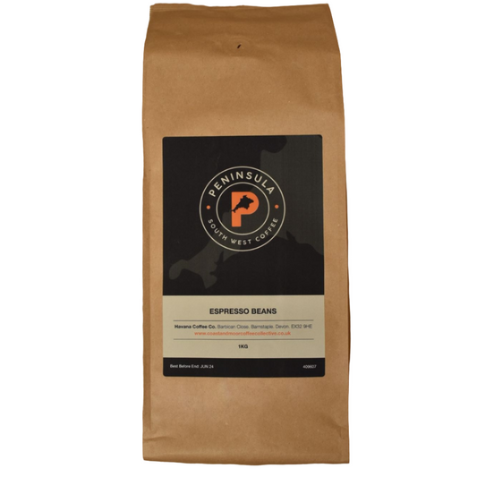 A package of Peninsula Espresso Beans weighing 1 kg, with a dark brown paper packaging featuring the brand logo and product information.