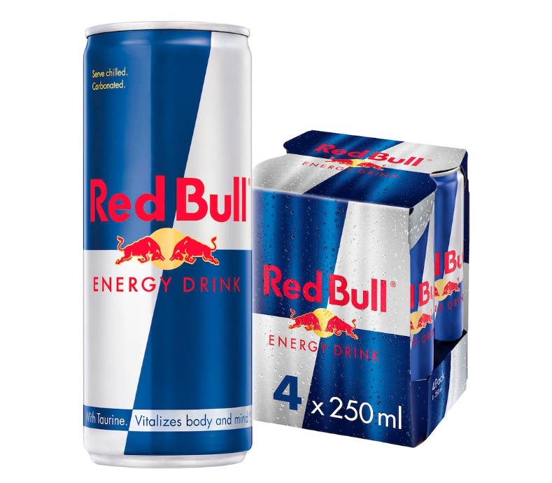 A single Red Bull Energy Drink can stands next to a four-pack carton of the same beverage on a plain white background. The packaging is predominantly blue and silver with red and yellow branding.