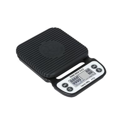 Black digital kitchen scale on a white background
