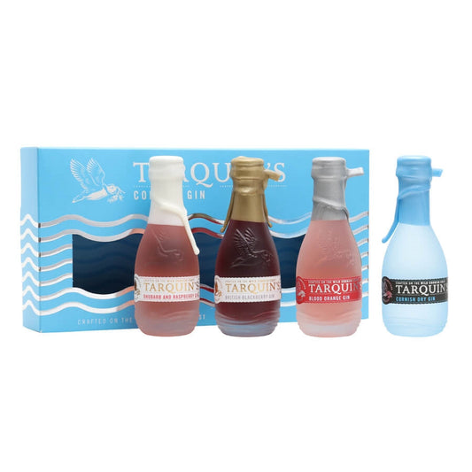 A set of miniature gin bottles in various colors presented in a blue and white box with the brand name 'Tarquins' visible on the packaging.