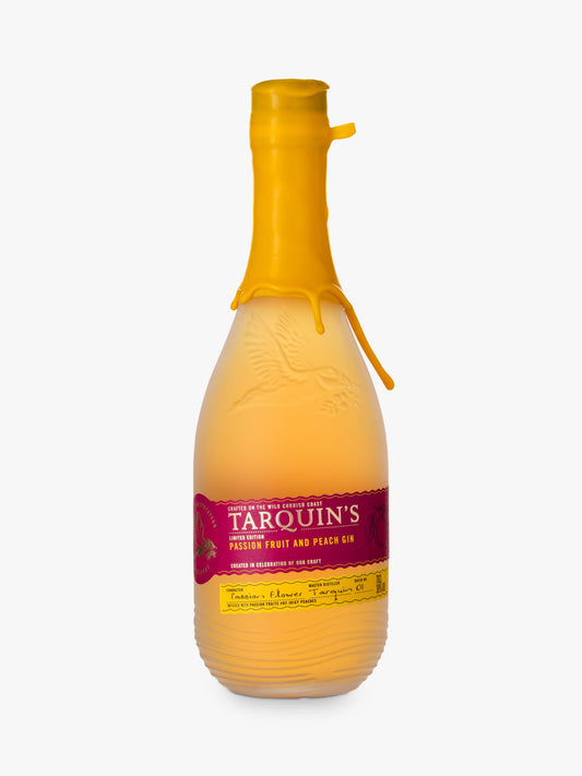 A bottle of Tarquins Peach & Passionfruit Gin with a yellow cap and a label that includes the brand name and flavor.