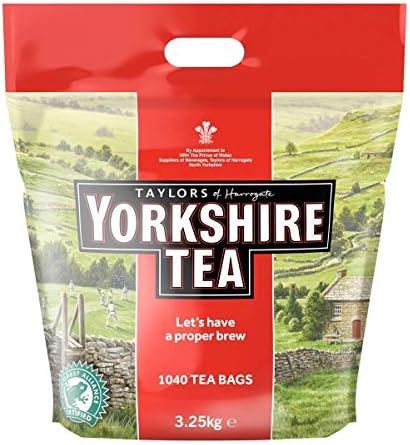 A package of Taylors of Harrogate Yorkshire Tea bags, featuring a scenic image of a English countryside landscape.