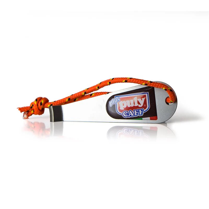 A silver-colored filter basket removal tool with an orange handle, featuring a label with the brand 'PULY' and the product name 'CAPP'.