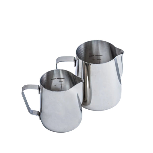 Two stainless steel steam jugs with measurement markings and a handle on the side.